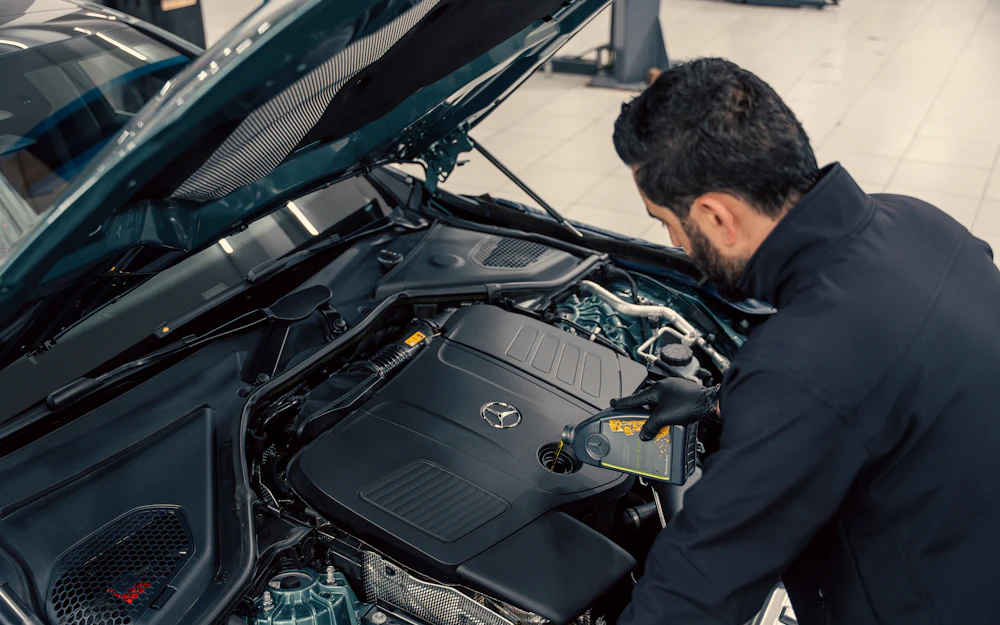 Mechanic repairing a car engine