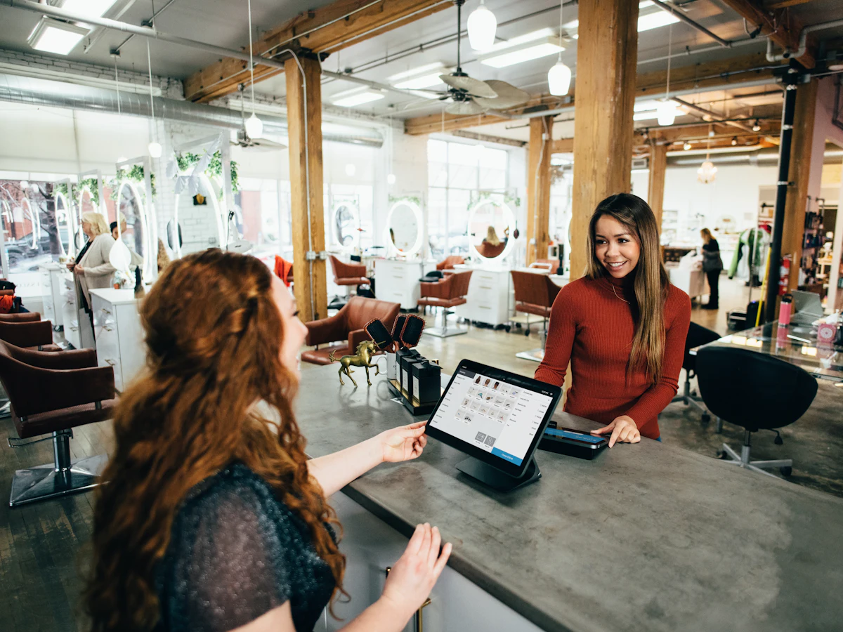 Small business owner serving a customer