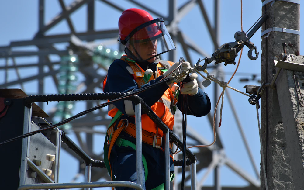 Electrician working on power lines
