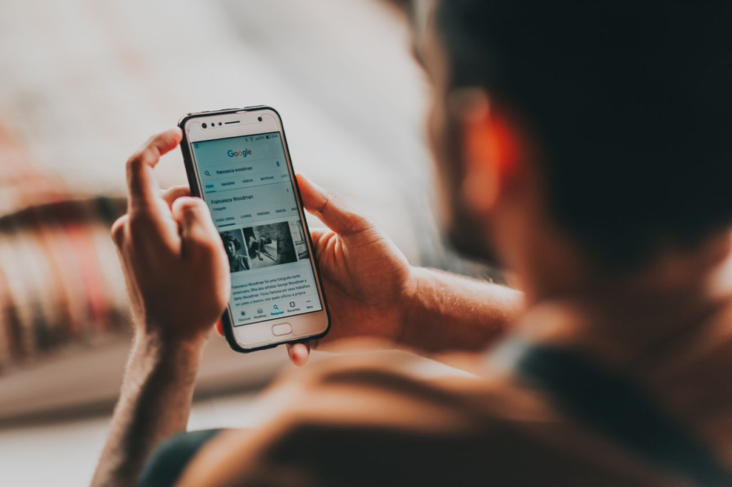Person searching for a local business on a smartphone